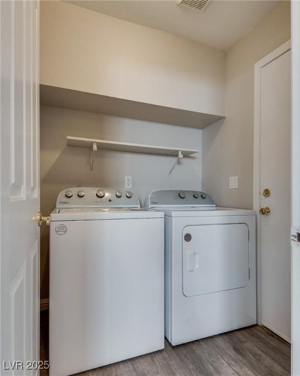 7816 Calico Flower Ave, Las Vegas, NV 89128 - washroom with washer and dryer and wood finished floors