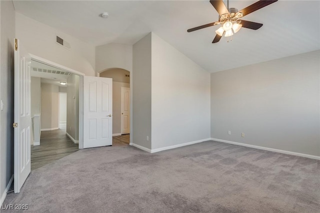 7816 Calico Flower Ave, Las Vegas, NV 89128 - unfurnished bedroom with carpet, arched walkways, a ceiling fan, and high vaulted ceiling