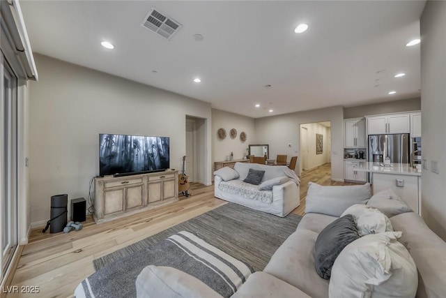 32 Tatahatso Point St, Henderson, NV 89011 - living area featuring recessed lighting and light wood-type flooring