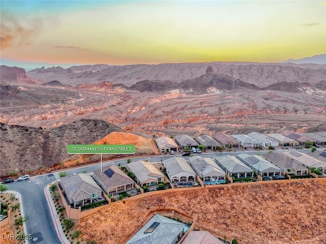 32 Tatahatso Point St, Henderson, NV 89011 - aerial view at dusk of a mountain view and a residential view