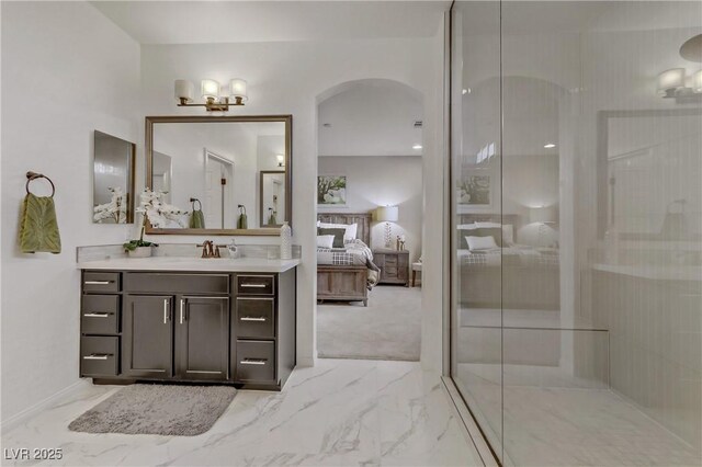 8992 Sparkling River Ct, Las Vegas, NV 89178 - bathroom with marble finish flooring, ensuite bathroom, vanity, and an enclosed shower