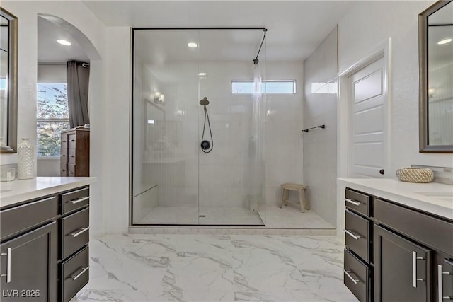 8992 Sparkling River Ct, Las Vegas, NV 89178 - full bath featuring walk in shower, two vanities, marble finish flooring, and recessed lighting