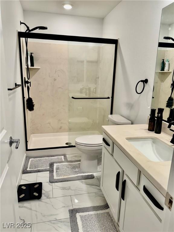 10411 Rose Palisade St, Las Vegas, NV 89141 - full bathroom with vanity, a stall shower, and marble look tile flooring