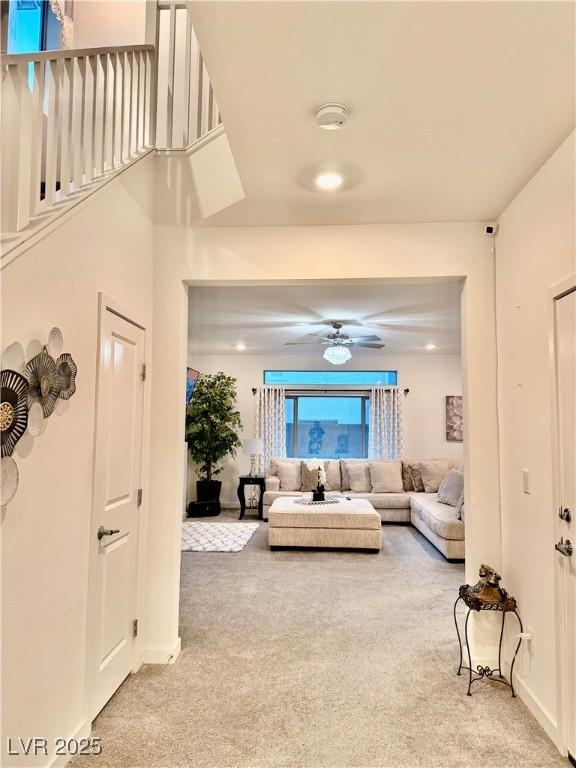 10411 Rose Palisade St, Las Vegas, NV 89141 - living area with light colored carpet and ceiling fan