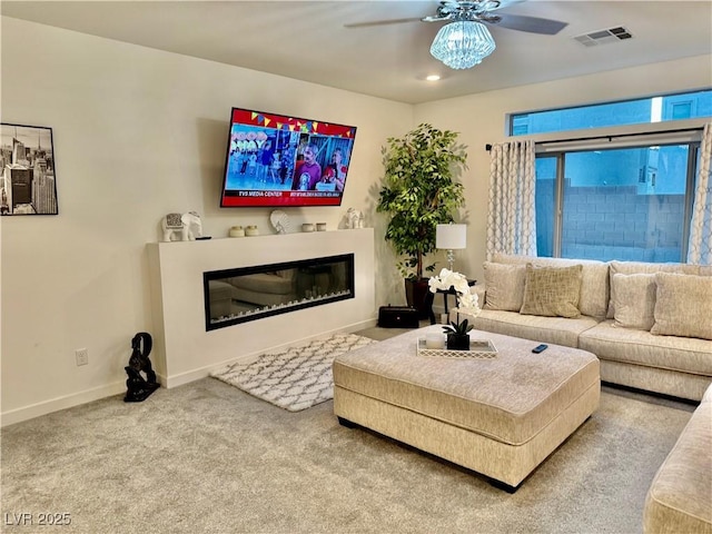 10411 Rose Palisade St, Las Vegas, NV 89141 - living room featuring a ceiling fan, a glass covered fireplace, carpet flooring, and recessed lighting
