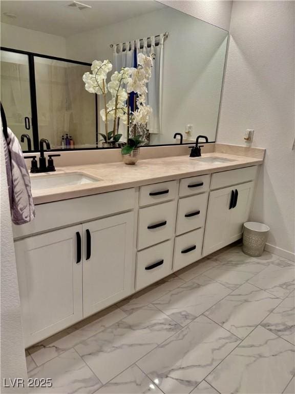 10411 Rose Palisade St, Las Vegas, NV 89141 - bathroom with marble look tile flooring, double vanity, and a stall shower