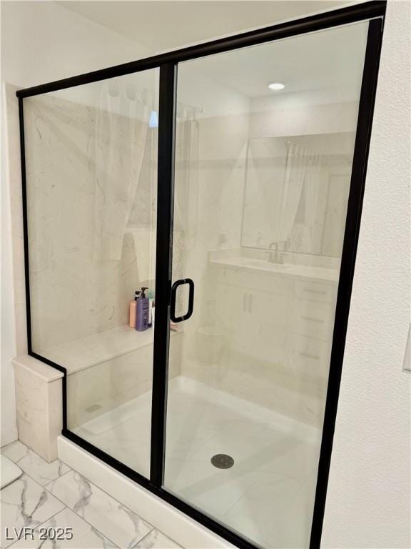 10411 Rose Palisade St, Las Vegas, NV 89141 - bathroom featuring marble look tiles and a marble finish shower