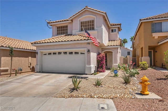 2180 Polynesia Cir, Henderson, NV 89074 - mediterranean / spanish house with a tile roof, stucco siding, driveway, and a garage
