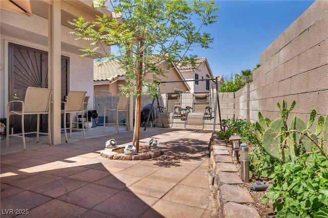 2180 Polynesia Cir, Henderson, NV 89074 - fenced backyard with a patio area