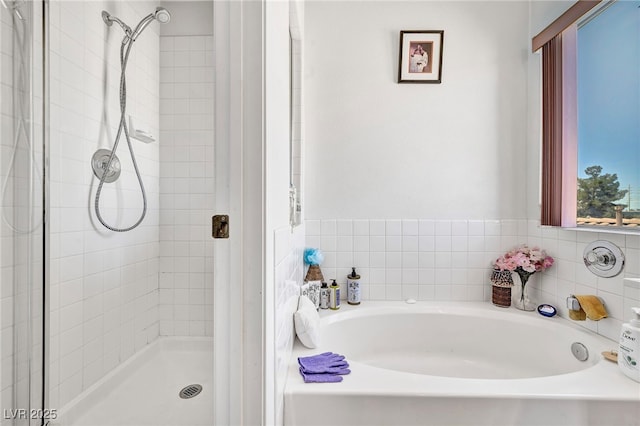 2180 Polynesia Cir, Henderson, NV 89074 - bathroom featuring a garden tub and a shower stall
