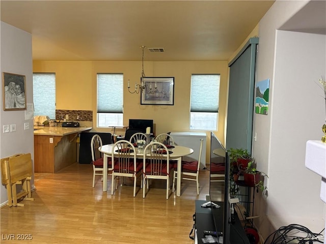 2180 Polynesia Cir, Henderson, NV 89074 - dining space featuring plenty of natural light and light wood-style floors