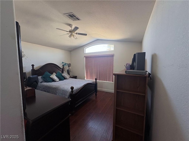 2180 Polynesia Cir, Henderson, NV 89074 - bedroom featuring lofted ceiling, dark wood-style floors, a ceiling fan, and a textured ceiling
