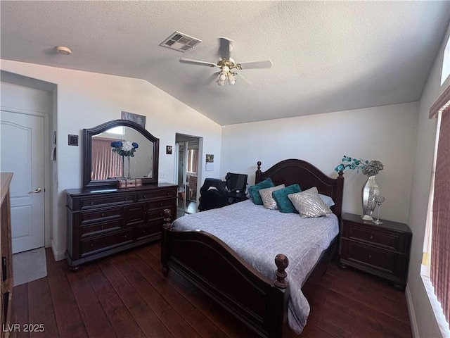 2180 Polynesia Cir, Henderson, NV 89074 - bedroom with lofted ceiling, dark wood-style floors, ceiling fan, and a textured ceiling