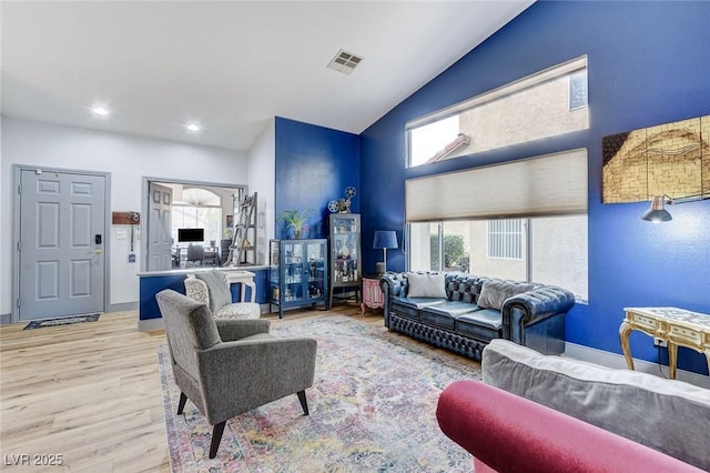 8926 Termoli St, Las Vegas, NV 89123 - living room with wood finished floors, recessed lighting, and high vaulted ceiling