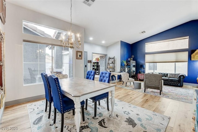 8926 Termoli St, Las Vegas, NV 89123 - dining space with a chandelier, wood finished floors, vaulted ceiling, and recessed lighting
