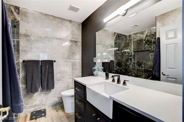 8926 Termoli St, Las Vegas, NV 89123 - full bathroom featuring vanity, wood finished floors, and tiled shower