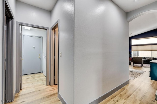 8926 Termoli St, Las Vegas, NV 89123 - corridor with arched walkways and light wood-type flooring