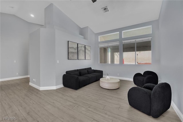 5509 Rose Thicket St, Las Vegas, NV 89130 - living room with light wood finished floors and high vaulted ceiling