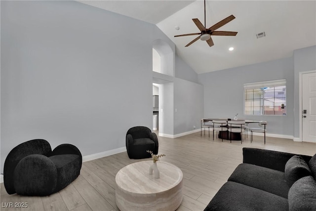 5509 Rose Thicket St, Las Vegas, NV 89130 - living area featuring ceiling fan, high vaulted ceiling, light wood-style floors, and arched walkways