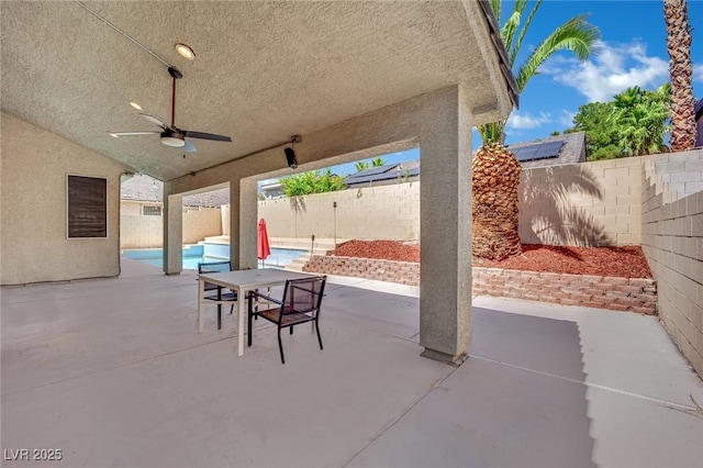 5509 Rose Thicket St, Las Vegas, NV 89130 - fenced backyard with a patio area and ceiling fan