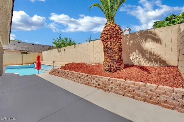 5509 Rose Thicket St, Las Vegas, NV 89130 - fenced backyard with a patio area