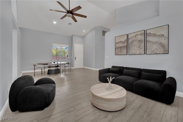 5509 Rose Thicket St, Las Vegas, NV 89130 - living room with wood finished floors, ceiling fan, high vaulted ceiling, and recessed lighting