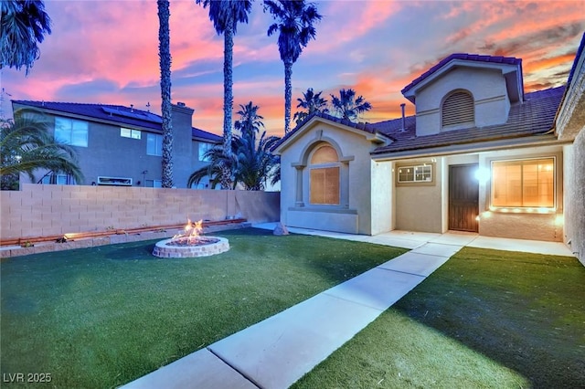 5509 Rose Thicket St, Las Vegas, NV 89130 - view of front of home featuring an outdoor fire pit and stucco siding