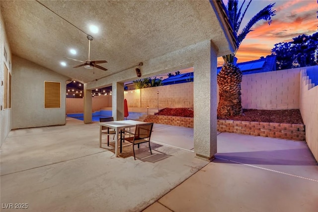 5509 Rose Thicket St, Las Vegas, NV 89130 - fenced backyard featuring a patio, outdoor dining space, and a ceiling fan