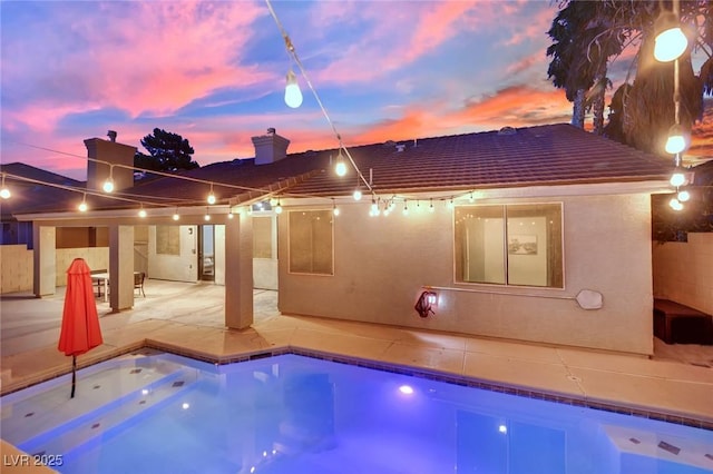 5509 Rose Thicket St, Las Vegas, NV 89130 - pool at dusk featuring a patio