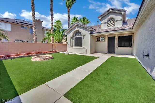 5509 Rose Thicket St, Las Vegas, NV 89130 - fenced backyard featuring an outdoor fire pit and a patio