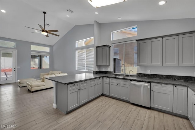 5509 Rose Thicket St, Las Vegas, NV 89130 - kitchen featuring dishwasher, gray cabinets, a peninsula, ceiling fan, and open floor plan