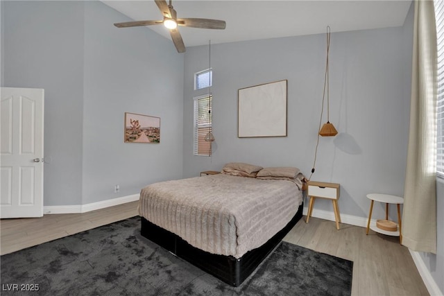 5509 Rose Thicket St, Las Vegas, NV 89130 - bedroom featuring wood finished floors, a high ceiling, and ceiling fan