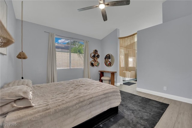 5509 Rose Thicket St, Las Vegas, NV 89130 - bedroom with wood finished floors, lofted ceiling, a ceiling fan, and ensuite bathroom