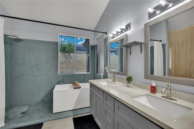 5509 Rose Thicket St, Las Vegas, NV 89130 - full bath with curtained shower, double vanity, a soaking tub, lofted ceiling, and wood finished floors