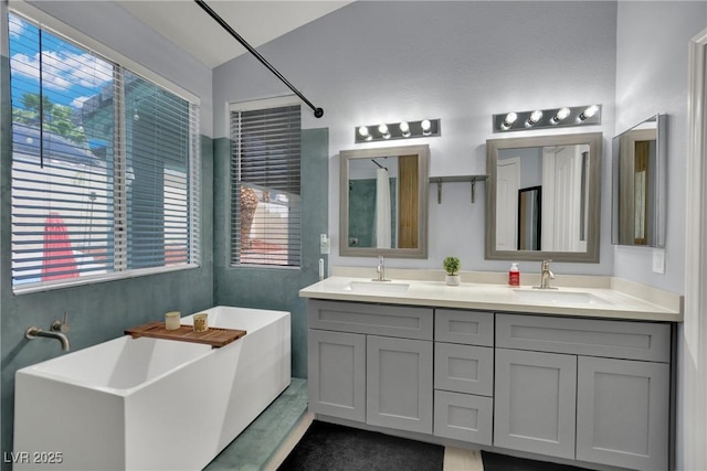 5509 Rose Thicket St, Las Vegas, NV 89130 - bathroom with a freestanding tub, double vanity, and healthy amount of natural light