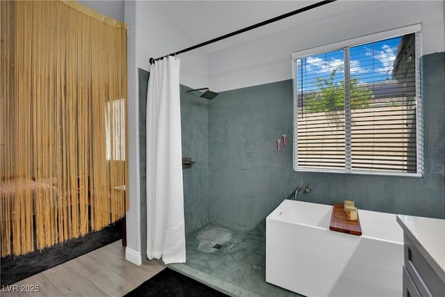 5509 Rose Thicket St, Las Vegas, NV 89130 - full bathroom with a soaking tub, a tile shower, wood finished floors, and vanity