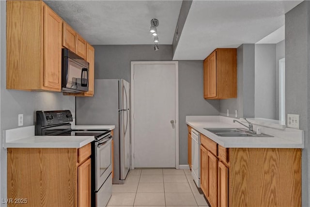 201 Mission Laguna Ln Unit 104, Las Vegas, NV 89107 - kitchen featuring black microwave, range with electric cooktop, light countertops, light tile patterned floors, and dishwasher