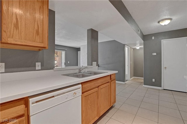 201 Mission Laguna Ln Unit 104, Las Vegas, NV 89107 - kitchen with dishwasher, light tile patterned flooring, a textured ceiling, and light countertops