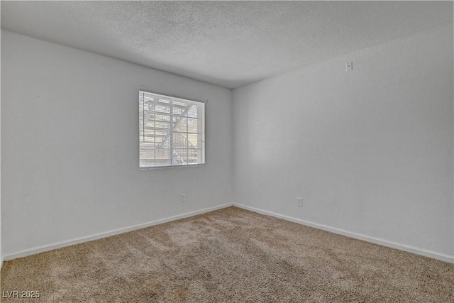 201 Mission Laguna Ln Unit 104, Las Vegas, NV 89107 - empty room with carpet flooring and a textured ceiling