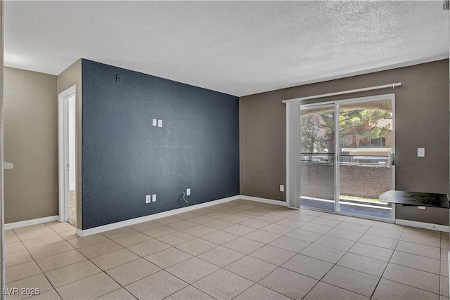 201 Mission Laguna Ln Unit 104, Las Vegas, NV 89107 - unfurnished room with a textured ceiling and light tile patterned floors