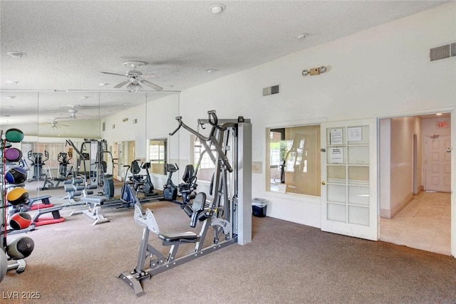 201 Mission Laguna Ln Unit 104, Las Vegas, NV 89107 - exercise room featuring carpet floors, ceiling fan, a textured ceiling, and a towering ceiling