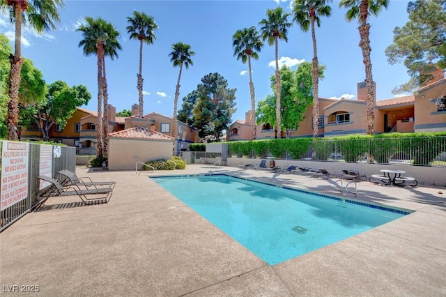 201 Mission Laguna Ln Unit 104, Las Vegas, NV 89107 - community pool featuring a patio area and a residential view