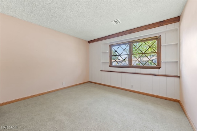 2400 Llewellyn Dr, Las Vegas, NV 89102 - unfurnished room with light colored carpet and a textured ceiling