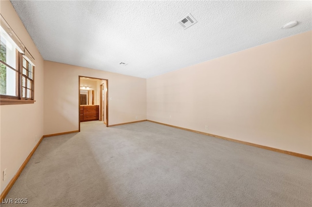 2400 Llewellyn Dr, Las Vegas, NV 89102 - empty room with light colored carpet and a textured ceiling