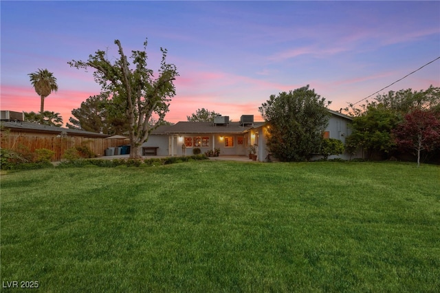 2400 Llewellyn Dr, Las Vegas, NV 89102 - back of property at dusk with a patio area