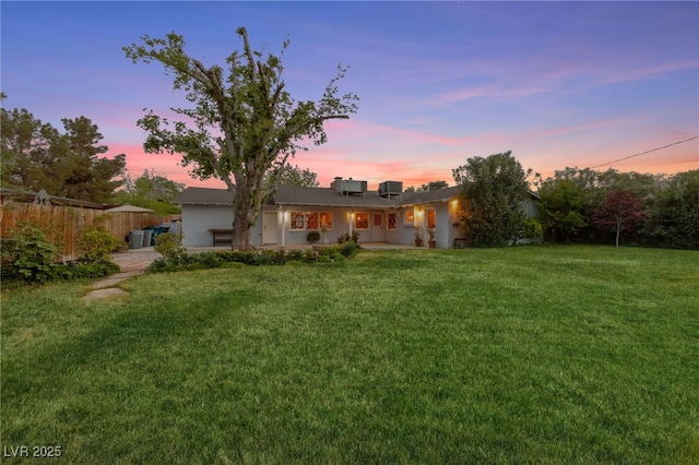 2400 Llewellyn Dr, Las Vegas, NV 89102 - yard at dusk with driveway and a garage