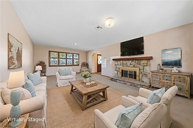 2400 Llewellyn Dr, Las Vegas, NV 89102 - carpeted living room with arched walkways and a fireplace