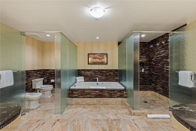 2000 Fashion Show Dr Unit 6109, Las Vegas, NV 89109 - bathroom with a bidet, a garden tub, a stall shower, tile walls, and marble finish floors