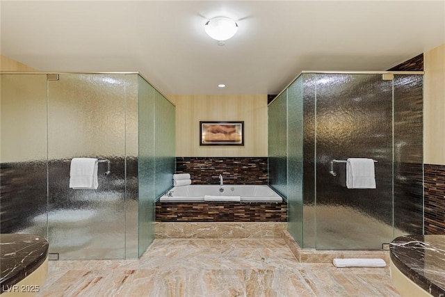 2000 Fashion Show Dr Unit 6109, Las Vegas, NV 89109 - bathroom with a bath, marble finish flooring, and a shower stall