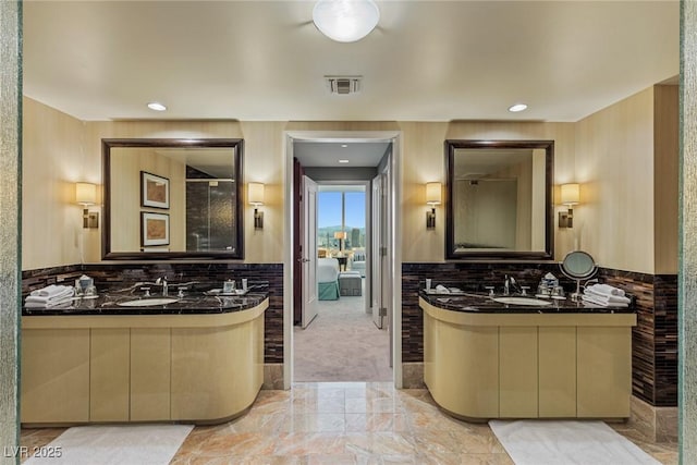 2000 Fashion Show Dr Unit 6109, Las Vegas, NV 89109 - full bath with two vanities, marble finish flooring, and recessed lighting